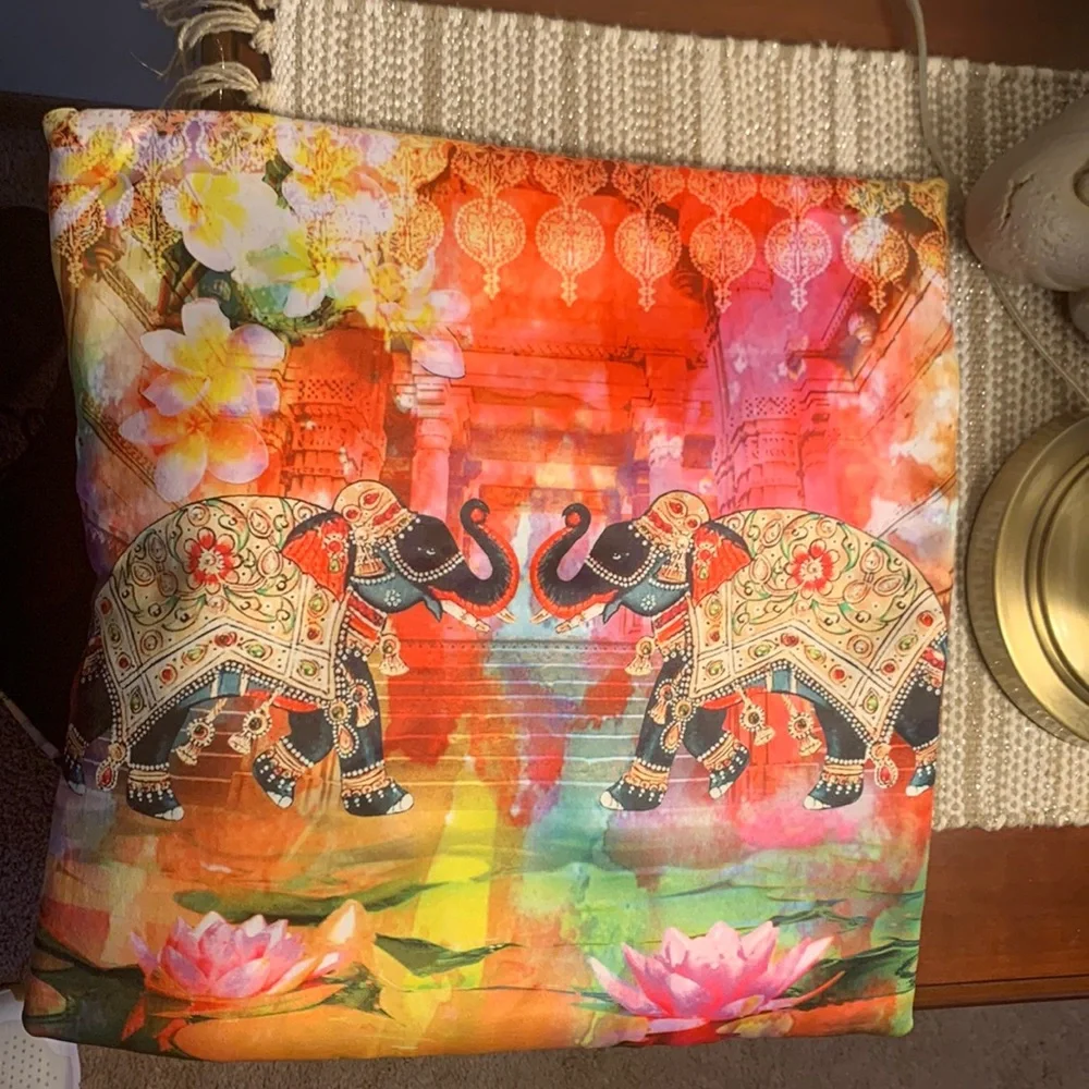 Pair of pillow covers. Multi colored with 2 elephants on front